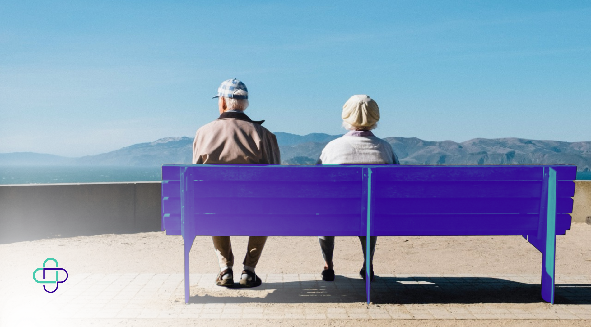 Older couple sitting on a beach bench during Support at Home assessments